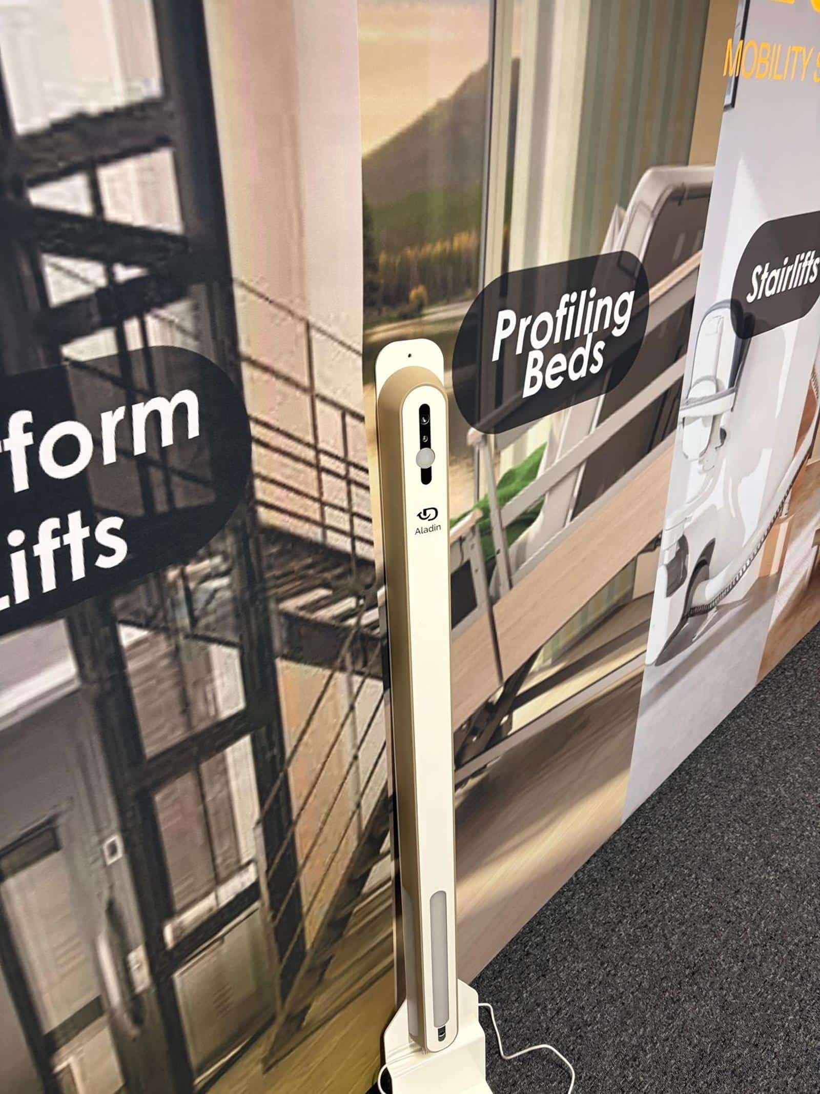 The E&M Mobility Specialists team with installation and care equipment branding
