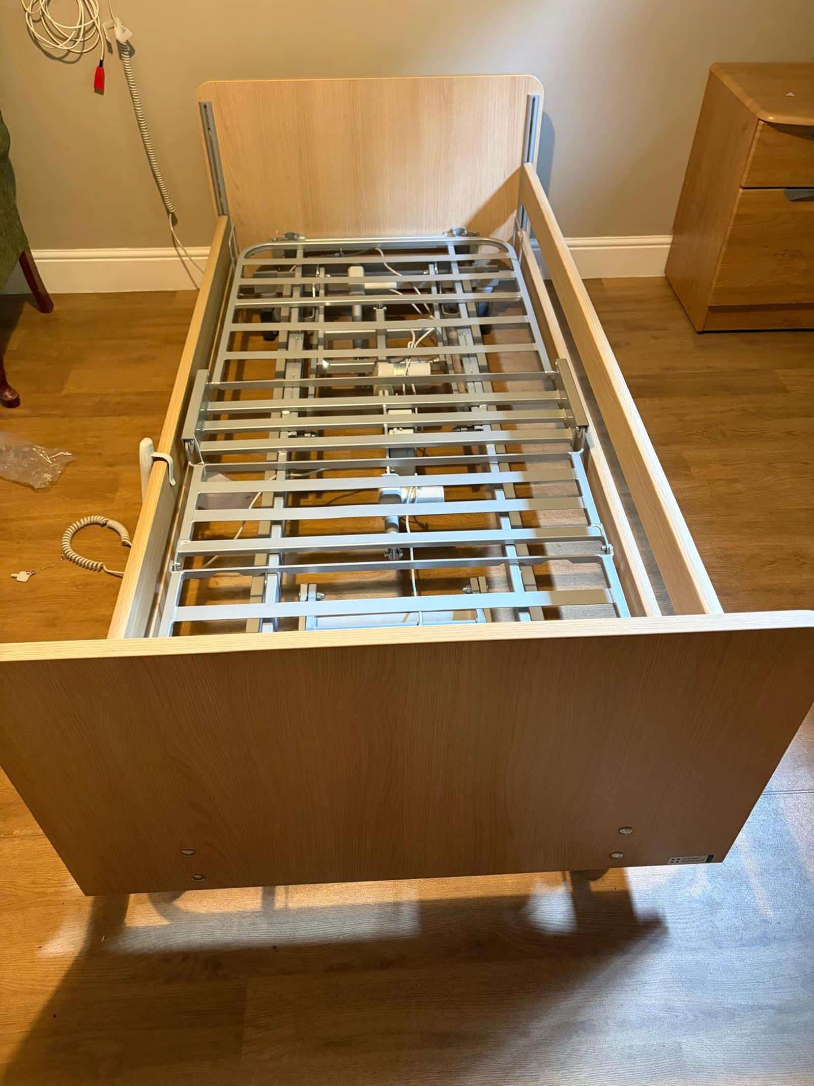 Profiling bed frame and mechanism exposed for routine maintenance